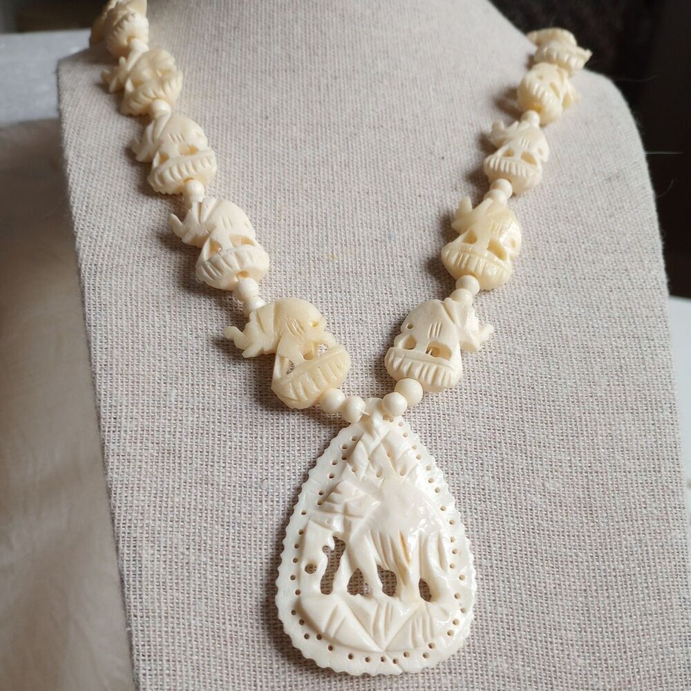 Vintage Carved Elephant marching graduated acrylic 24 in Necklace